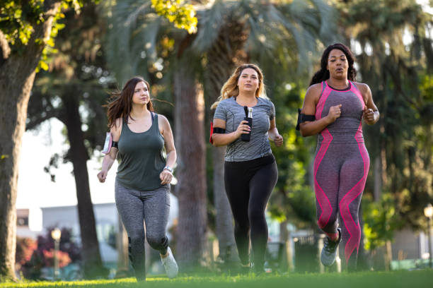 istock Young women jogging and getting healthy at the park 1177267592