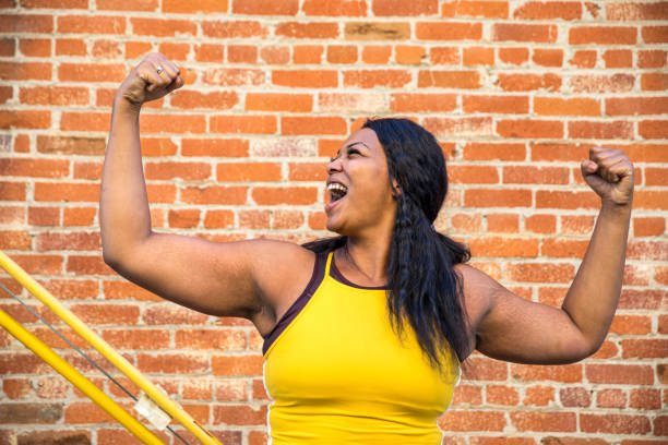 istock Young woman jogging and getting healthy at the park 1177267821