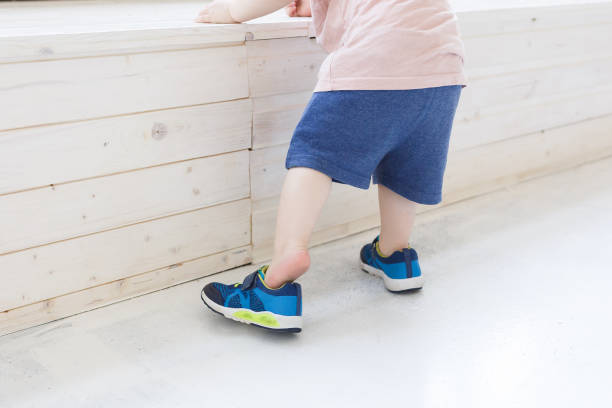 istock A one year old boy taking some of his first steps 1177267903