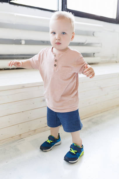 istock A one year old boy taking some of his first steps 1177267954