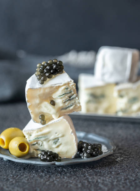 istock White and blue mold cheese with black caviar close-up 1177268784