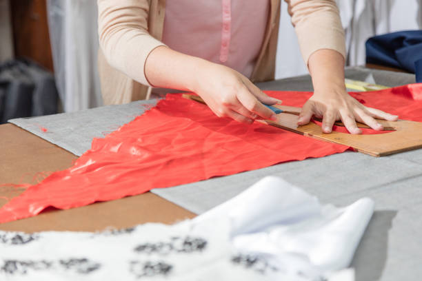 istock female hands measuring fabric at seamstress workplace 1177271556