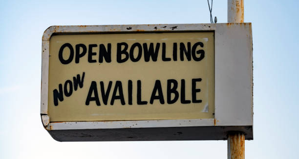 istock Old Rusted Lighted Sign at Recreation Center says Open Bowling 1177271912
