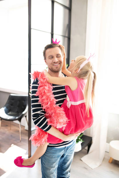 istock Loving dad lifting his princess while having fun at home 1177274392
