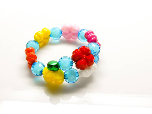 istock Multi-colored bracelets with beads. Colourful child's bead bracelet.