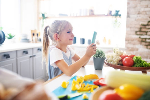 istock Blonde girl using smartphone while standing near father 1177274793