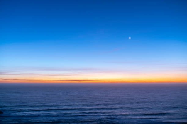 Lighthouse Searchlight beam on sunset with fog.