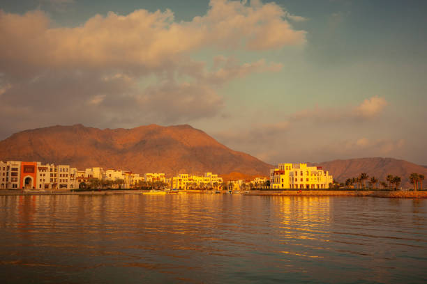 istock as sifah bay at sunset, oman 1177279217