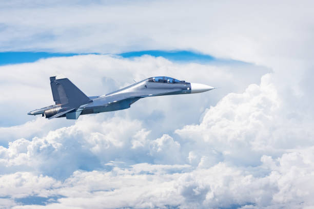 istock Combat fighter jet flies high in the clouds. 1177279753