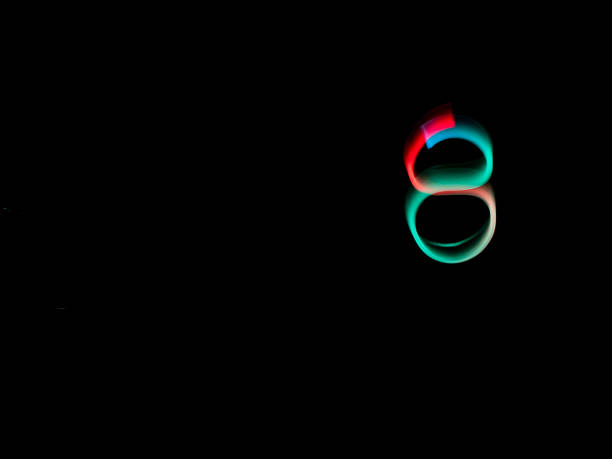 istock Numbers, from 0 to 9, made with colour lanterns and black background, using the technique of light painting. 1177279817