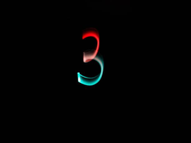istock Numbers, from 0 to 9, made with colour lanterns and black background, using the technique of light painting. 1177279830