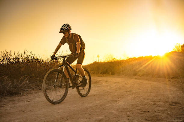 istock Mountian Biker Riding Into The Sunset 1177284327