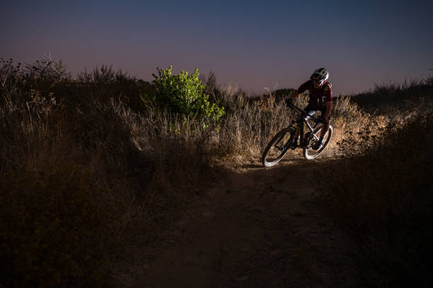 istock Mountain Biker Riding In A Night Scene 1177285031
