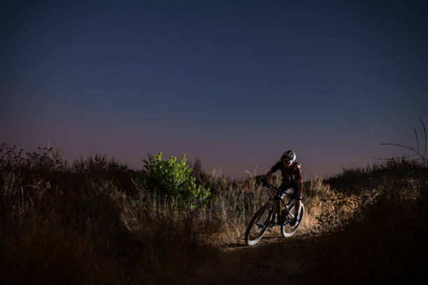 istock Mountain Biker Riding In A Night Scene 1177285062