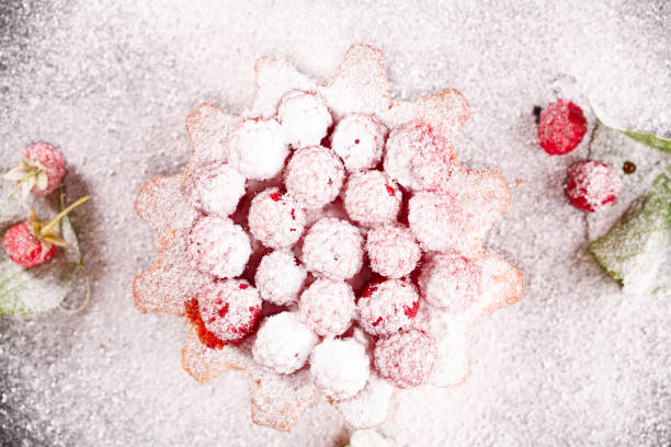 istock muffin decorated with fresh raspberries on a black plate. 1177285524