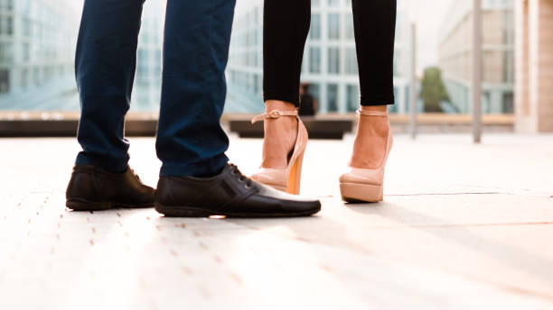 istock A man and a woman's legs on city background 1177286794