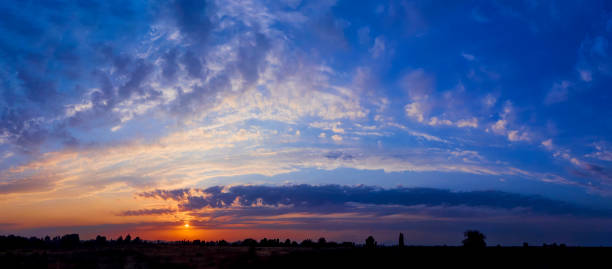 istock Bright sunlight through the clouds against a breathtaking evening sky at sunset. 1177288372