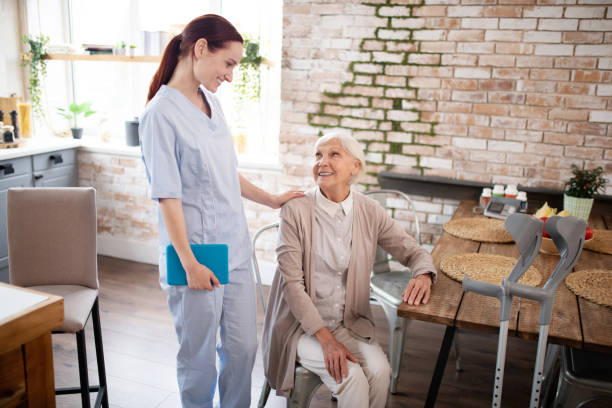istock Aged woman talking to her helpful diligent nurse 1177288507