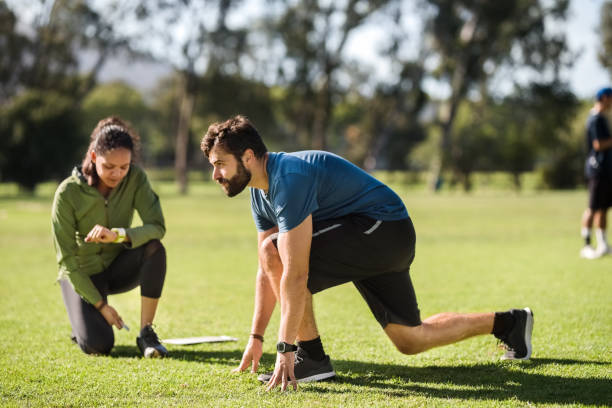 istock Sportsman exercising with coach 1177291317