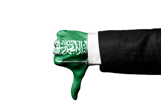 biznesmen pokazano thumbs down znak strony z arabii saudyjskiej flaga na rękę / koncepcja flagi (kliknij, aby uzyskać więcej) - flag of jihad zdjęcia i obrazy z banku zdjęć