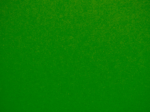 Close up photo of green textured empty cardboard , can  be used as background.