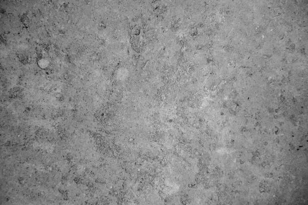 istock Abstract monochrome background. Rough concrete floor covered with cement 1177300000