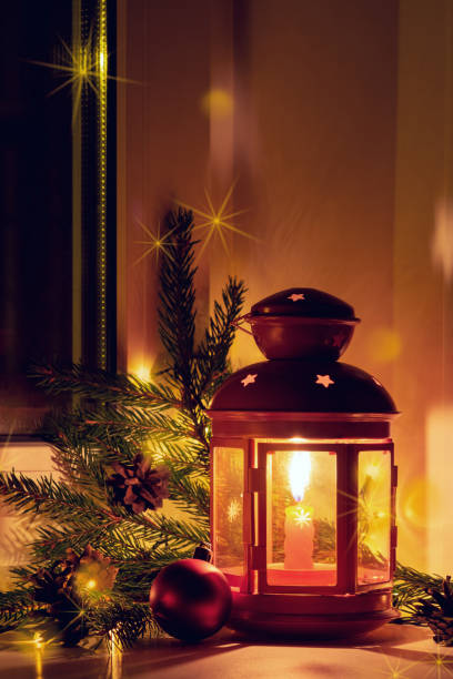 istock Christmas eve. Christmas tree and lantern at the window 1177302253