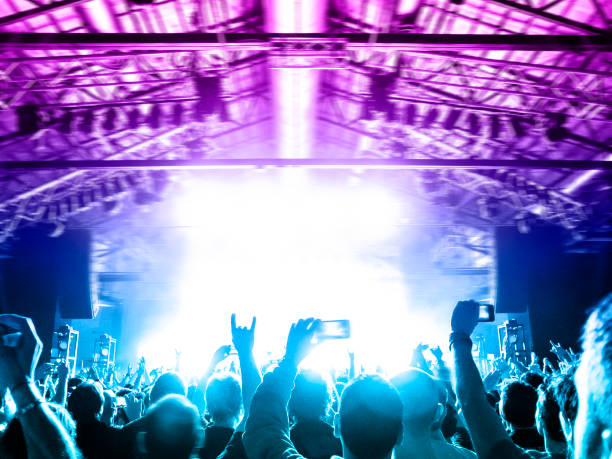 istock Concert blurred lights in a large crowded venue 1177303292