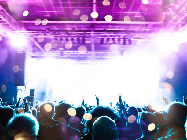 istock Concert blurred lights in a large crowded venue 1177303306