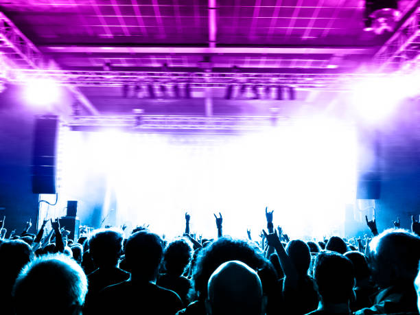 istock Concert blurred lights in a large crowded venue 1177303322