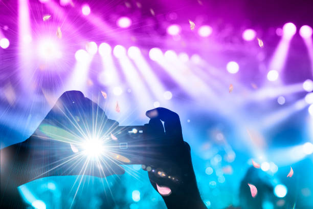 istock Concert blurred lights in a large crowded venue 1177303634