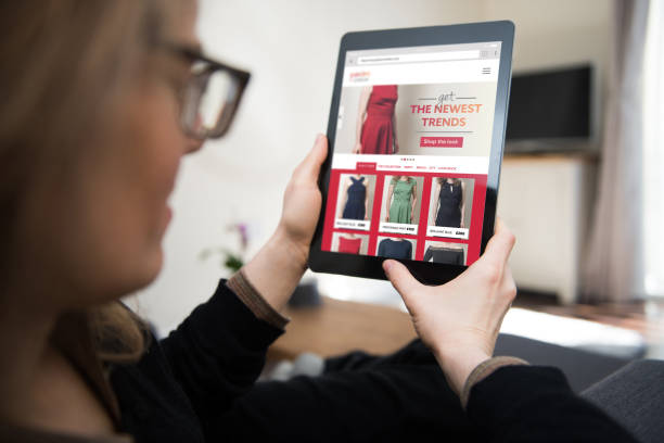 istock Woman looking at online clothes shop 1177303637