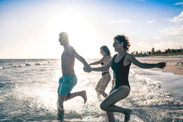 istock Friends Rushing In The Sea 1177303647