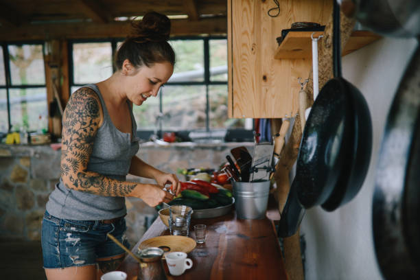 istock Woman preparing coffee in her outdoor kitchen 1177305504
