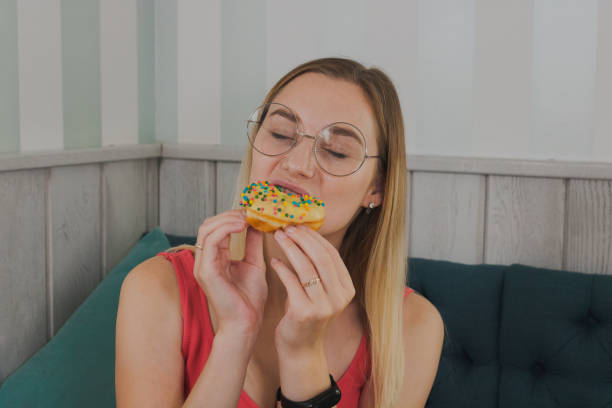 istock Girl in a cafe eats sweet and fresh desserts 1177314123