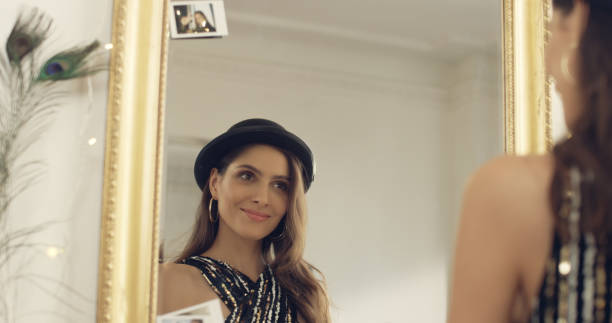 istock Seductive brunette trying on a bowler hat 1177315315