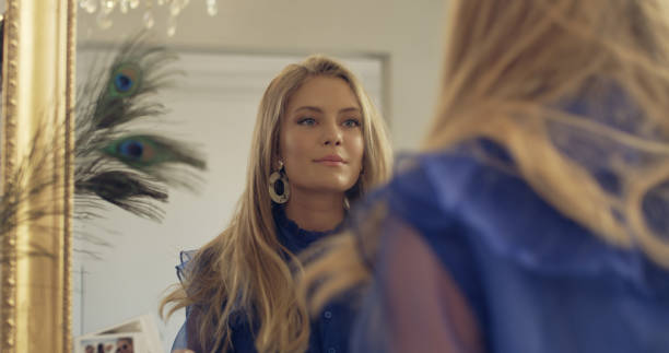 istock Elegant young woman preparing for a party 1177315473