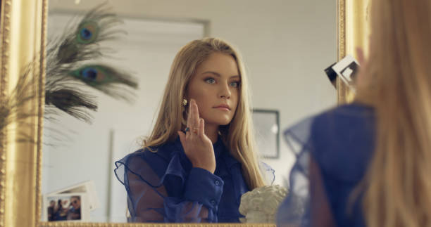 istock Elegant young woman preparing for a party 1177316003