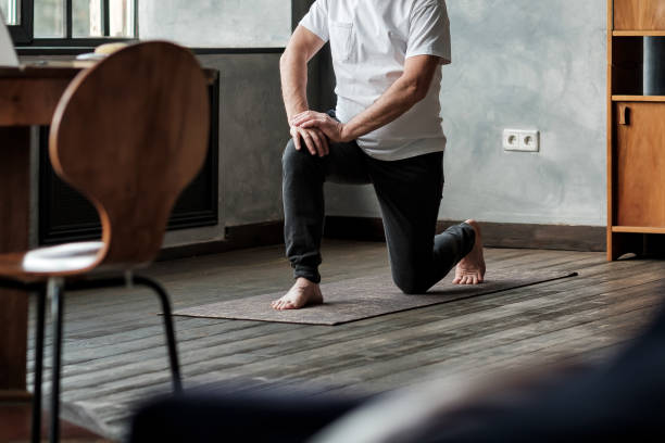 istock Senior hispanic man standing in warrior yoga pose variation 1177320107