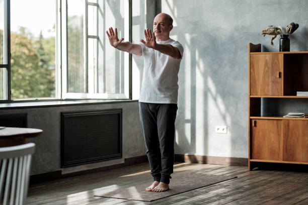 istock Hispanic man working out, yoga in basic standing asana tadasana 1177321472