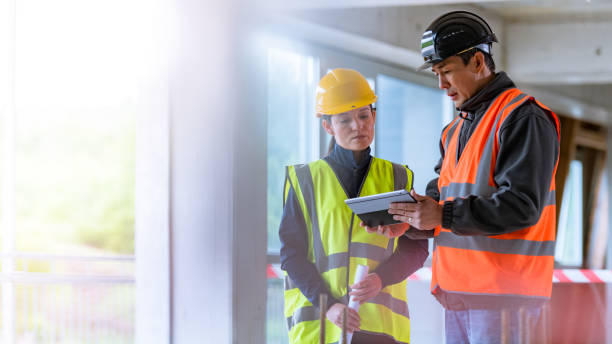 istock Architect and construction foreman looking at digital tablet on a construction site 1177326223
