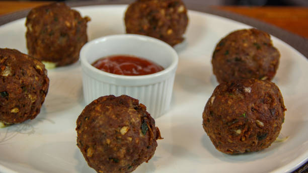 istock Big fried meatballs served with ketchup sauce on a plate 1177328377