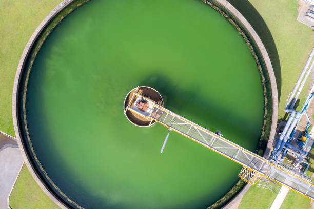 istock Aerial view of The Solid Contact Clarifier Tank type Sludge Recirculation in Water Treatment plant in factory. Industry and environment factory for ecology concept. 1177330218