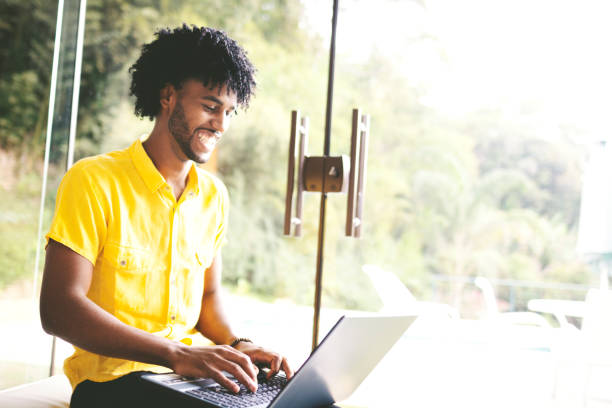 istock Portrait of a beautiful man using laptop and 1177330483