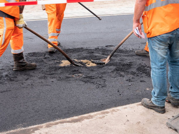 istock Workers posing asphalt in Dutch city central square 1177333795