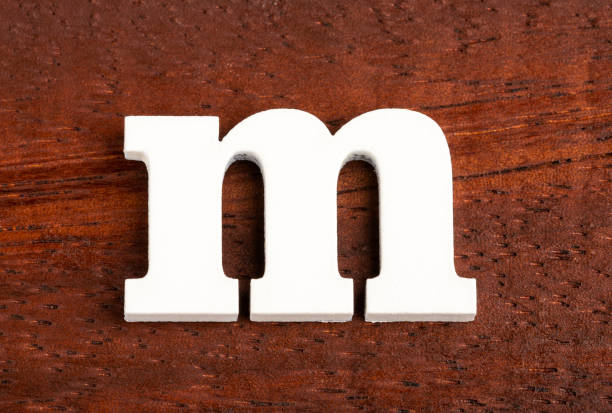 istock m - lowercase letter. Piece in wood 1177334597