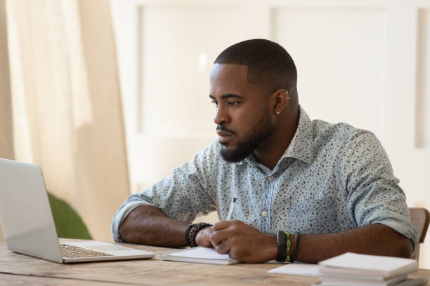 istock Concentrated millennial african american guy focused on online university courses. 1177334850