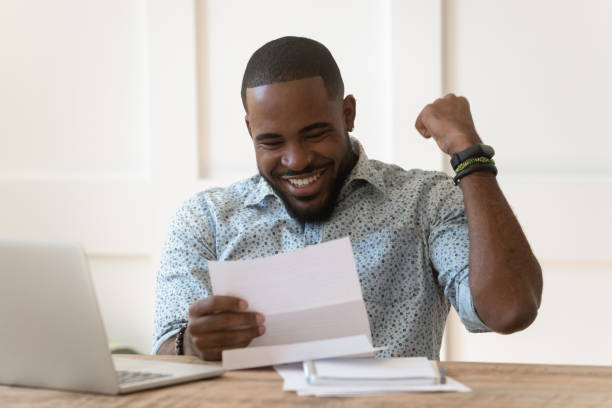 istock Happy african american guy received banking loan approval. 1177334864