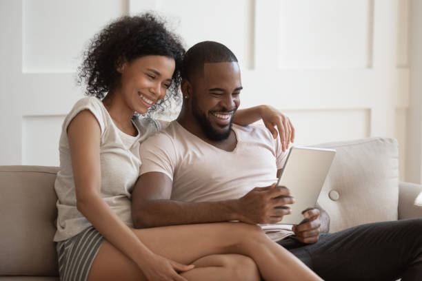istock Smiling african american couple using tablet together. 1177334880