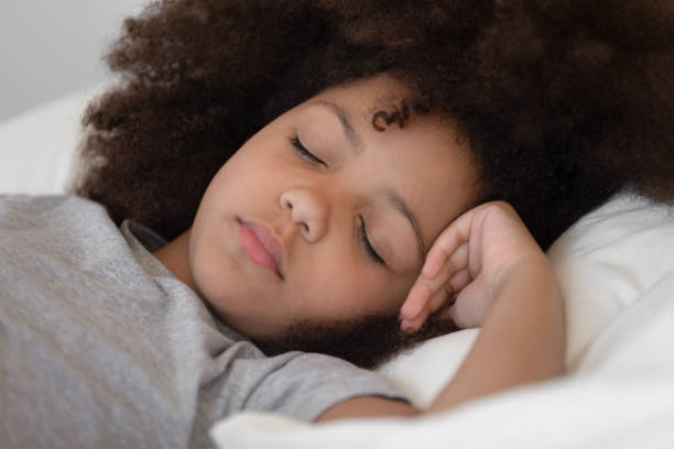 istock Close up mixed race cute peaceful child girl napping. 1177334924